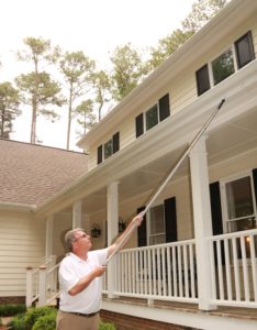 Tim Wiggins using one of the tools to inspect a house